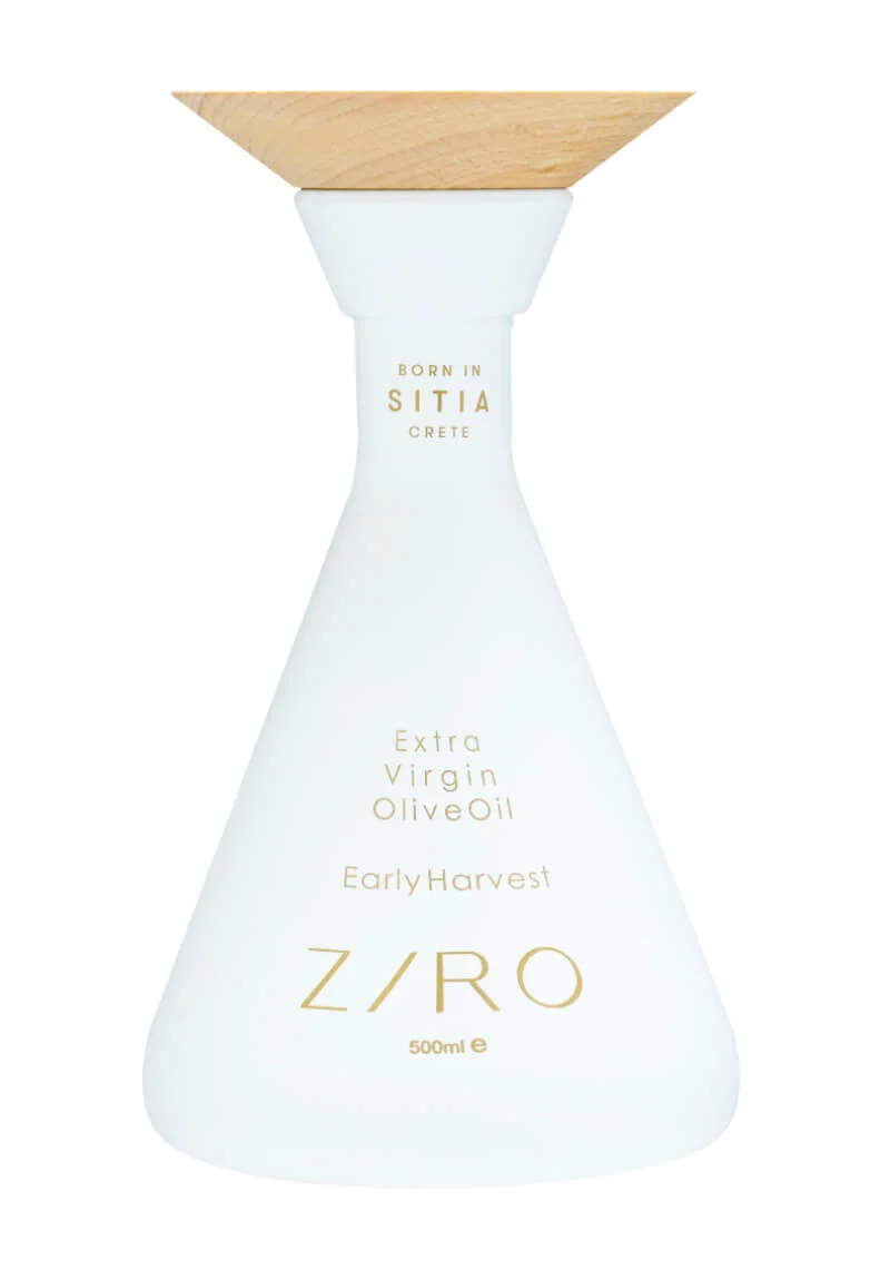 "Ziro Early Harvest EVOO - 500ml. Crafted in Crete's Sitia Geopark, this olive oil combines tradition and innovation. Unique conical bottle with a Paleokastro disc-inspired wooden cap."
