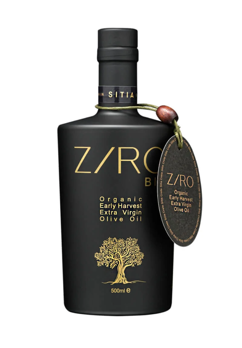 "A bottle of ZIRO Organic Early Harvest Extra Virgin Olive Oil from Sitia Geopark, Crete. The golden liquid is captured in a 500ml glass bottle, showcasing the excellence of this low acidity, fruity, and spicy olive oil. Ideal for pasta, grilled meats, and salads, it is a product of generations of expertise combined with modern science and technology."