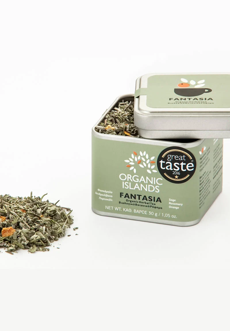 Image of Organic Islands Fantasia loose leaf tea in a container. The container is filled with a mix of dried sage leaves, rosemary leaves, and orange peel.