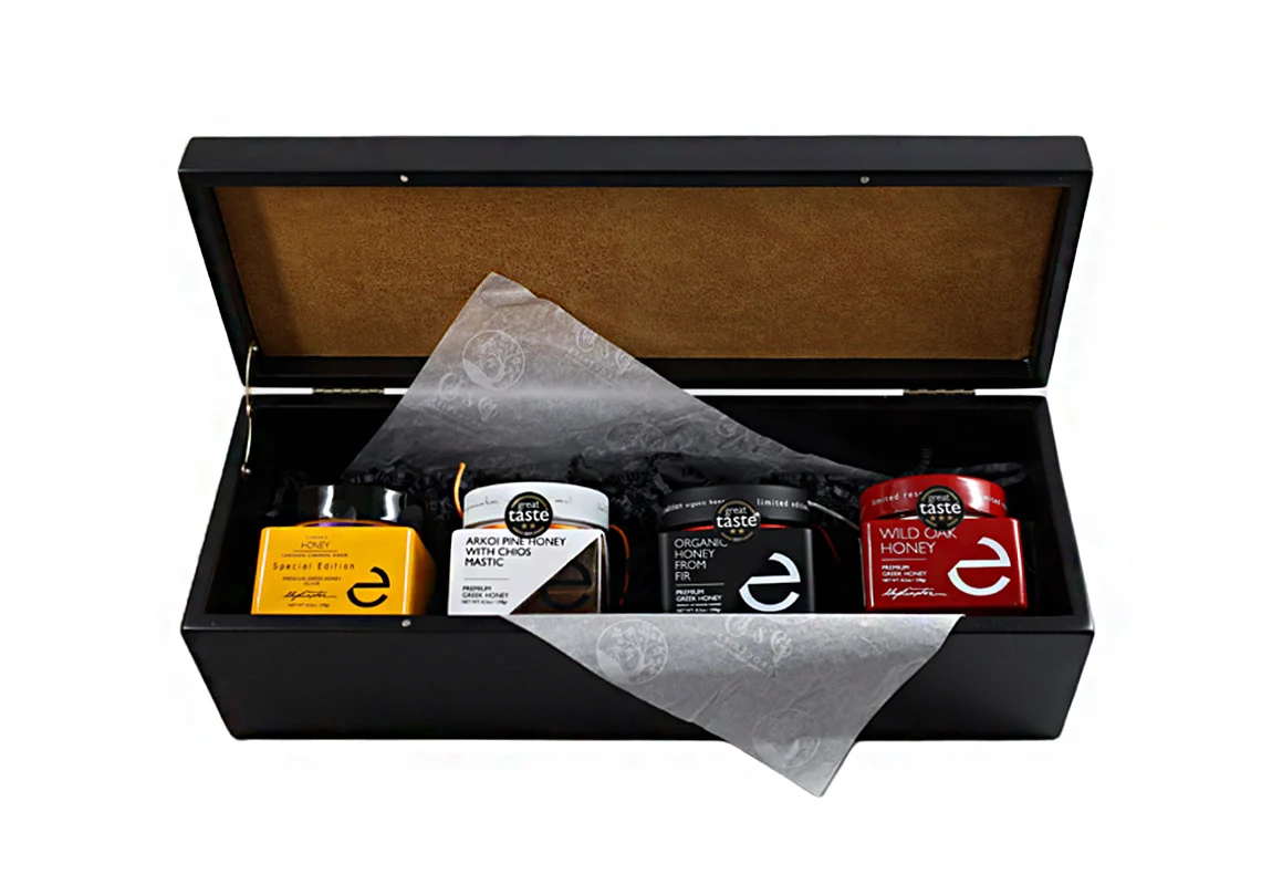 "Eulogia of Sparta Honey Selection - Premium honey varieties in a black wooden box with velvet lining. Perfect gift."