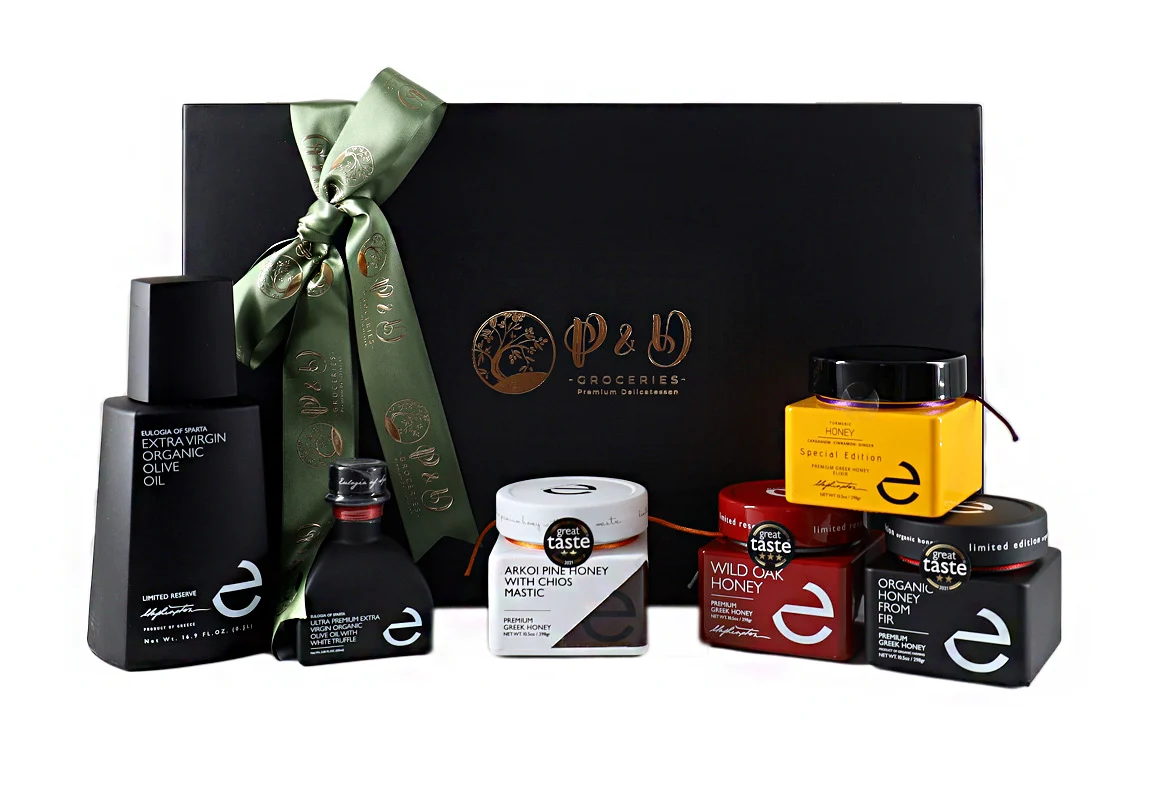 "Erleben Sie Luxus mit der 'Eulogia of Sparta' Geschenkbox – eine Mischung aus Premium-Honigsorten und Olivenölen in einer schwarzen Holzkiste