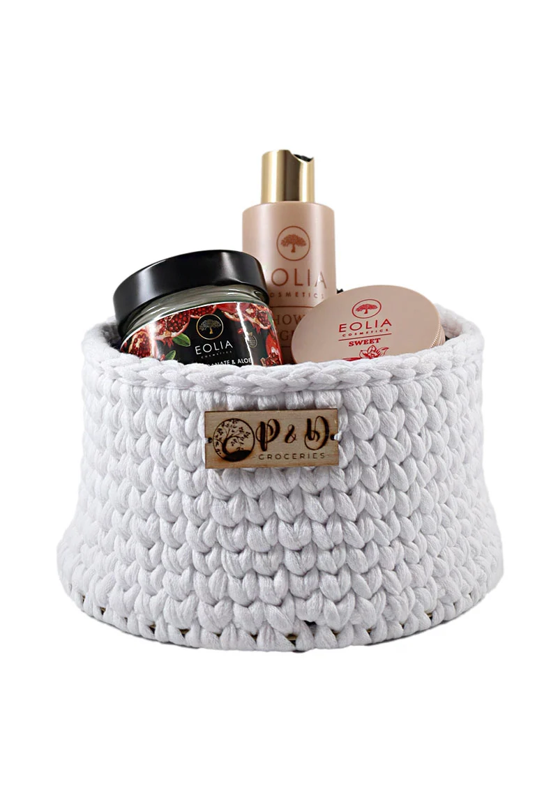Handwoven white cotton basket with wooden base, showcasing "Artemis" Beauty Gift Set from Eolia Cosmetics – Shower Gel, Body Butter, and Hand Cream.